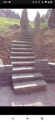 Hard scape step installation and retainer wall design and installation as well as landscaping