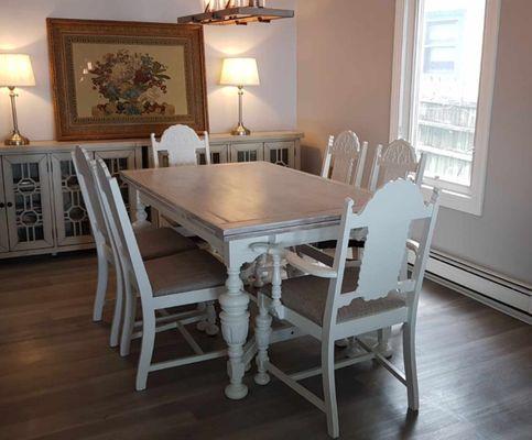 Completely updated dining room set with freshly painted chairs and whitewashed table