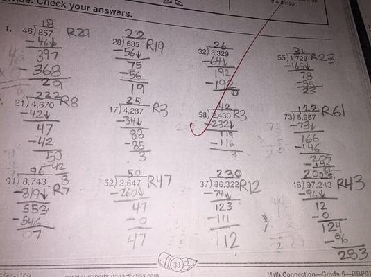 My 6 year old son doing division with remainder.