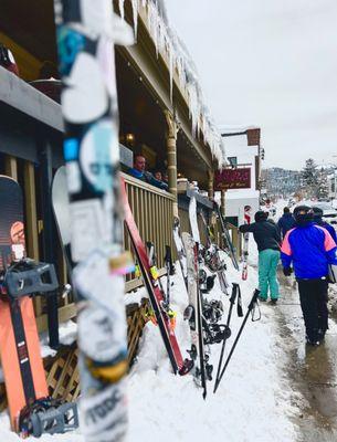 Outdoor dining area, snow and to prop up skis and snowboards