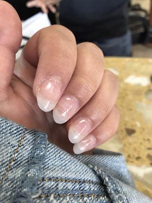 Fresh set of acrylics with gel top coat in almond shape.