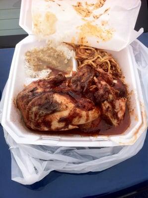 Half a chicken with spaghetti and rice and gravy