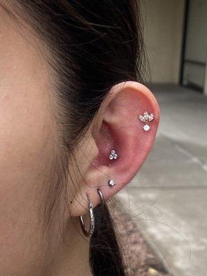 Conch piercing with CZ trinity