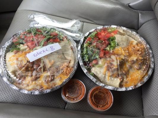 Steak burrito and chicken burrito. Both came with a side of yellow rice and a salad mmmmm