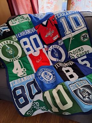 Sport jerseys make great lap throws.  Numbers and logos were used to made a wonderful Christmas gift for one young man.