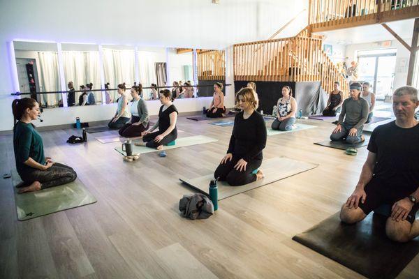 Breathwork at the beginning of a yoga class.