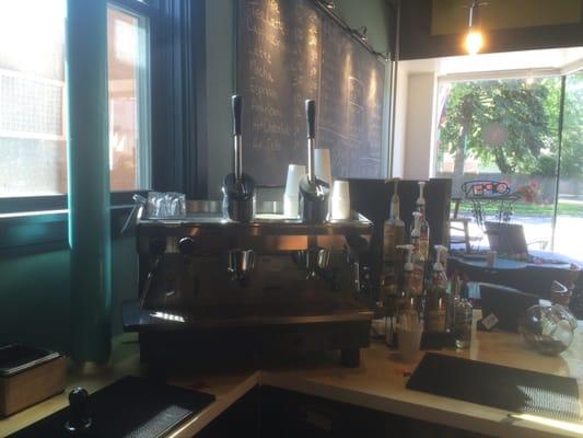 The coffee shop features a unique manual espressos machine.  The barista very literally "pulls shots."