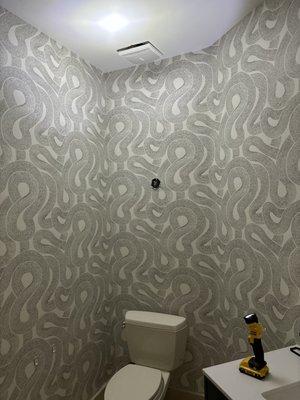 Bathroom walls installed with 21 inch match paper