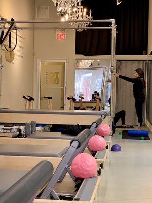 Small group class in the back of the studio.