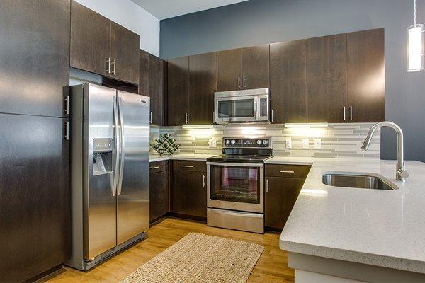 Kitchens also feature stainless steel appliances, USB charging ports and espresso cabinets