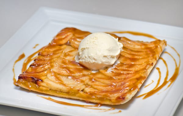 Apple Tart With Ice Cream. Homemade warm apple tart with creamy vanilla ice cream.