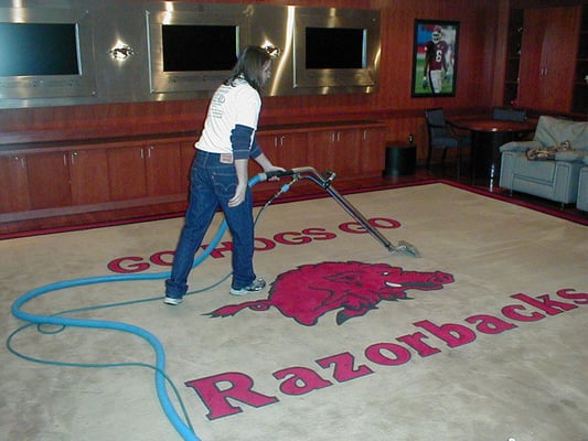 Cleaning the rug at Razorback Stadium (University of Arkansas) in preparation of the football season