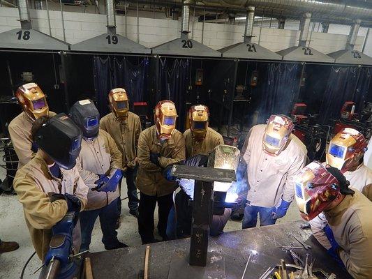 Jason demonstrating Stick welding 2G