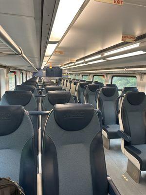 Double decker train cars with new and comfortable seats.