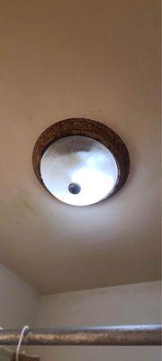 My son's light fixture in his bathroom full of water