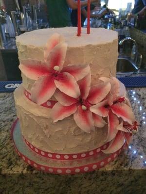 Custom birthday cake, red velvet with vanilla buttercream and stargazer lily sugar art, $70. Served 40-50 - absolutely amazing!