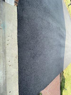 Nice and smooth! Freshly paved driveway with no more gap and dip at garage entry.