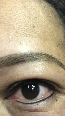 Eye liner and eyebrows permanent make up.