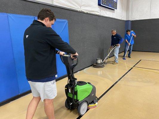 Cleaning up a gym floor for our valued customer!