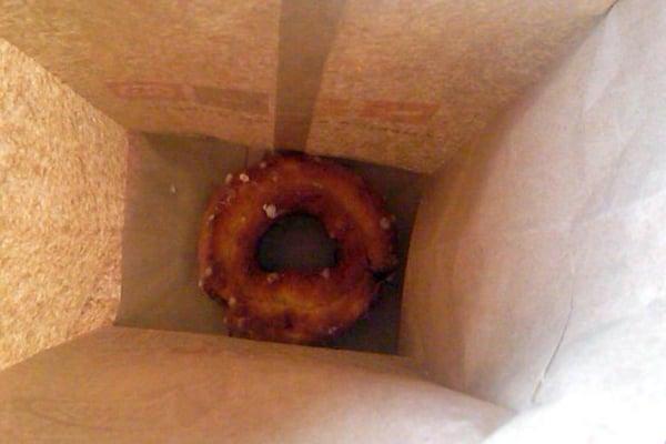 A donut to go (missing some wax paper)