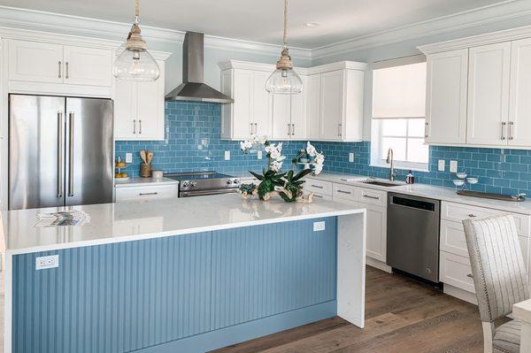 Bright and beachy kitchen with eat in island at The Tides at Vaca Cut.