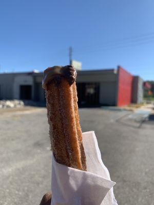 Cinnamon sugar churro dipped in dulce de leche & Nutella sauce