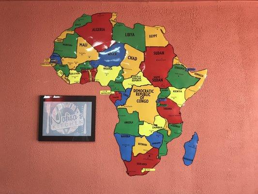 Map of Africa on the wall.