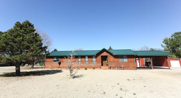 Perfect home on 5 acres just on the edge of town.  Metal Fence, Metal Roof, Metal Barn, New windows, New hardwood floors........