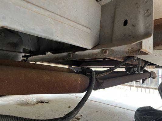 Bad wiring laying on the exhaust