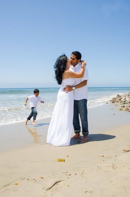 Mom and Dad having a beautiful moment but, someone was feeling left out.