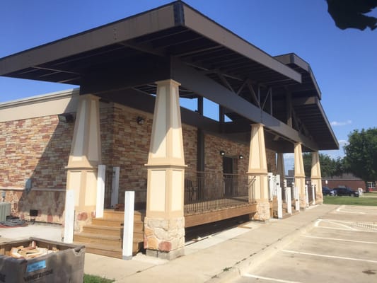 The church entrance is through the 1930's craftsman-style front porch.