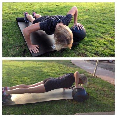 Body By Dave client Staci showing off doing medicine ball push-ups.