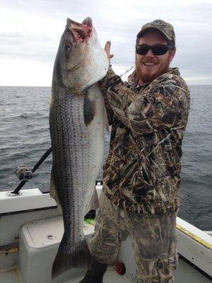 Captain Mike and a big striped Bass