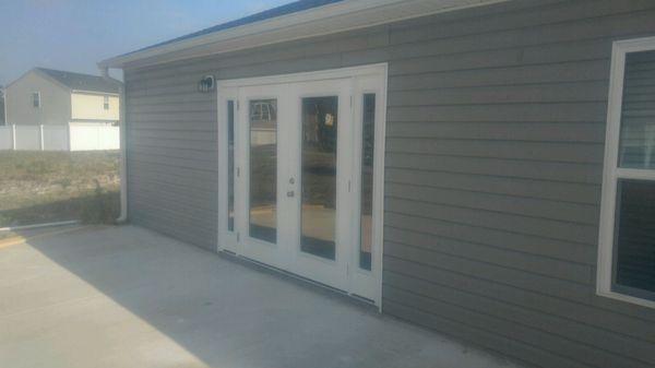 Oak island NC: Single door removed. Installed 8ft double door w/ADA compliant threshold for wheelchair accessibility.