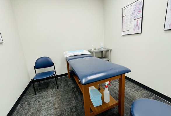 Clean and organized consultation room.  Note: sanitizer and disposable wipes under the table