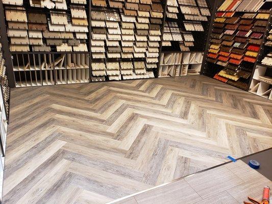 BiBi Floors Installed for the first time Luxury Vinyl Plank in Herringbone pattern.