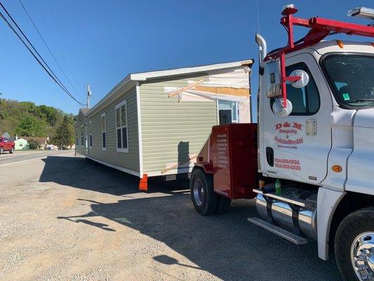 Hauling a mobile home to new location.