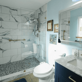 Blue Bell PA bathroom. Large format tile with a stone floor. This bathroom remodel took just over a week to complete for the home owners.