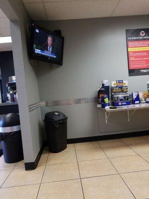 The waiting area has a nice size tv.