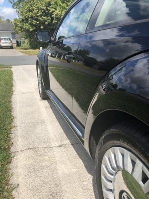 Grease was from front tire to back bumper from tire splash. Up the door panel and all along the chrome runner.