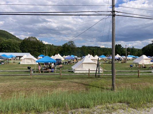 Field with a bunch of tents.