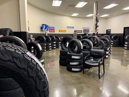 Tired? Take a seat in one the appropriately-spaced chairs and watch tv next all the tires in the store.