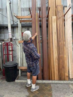 Dad measuring a piece of exotic wood.