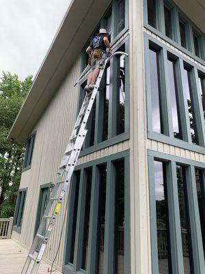 High exterior windows being washed