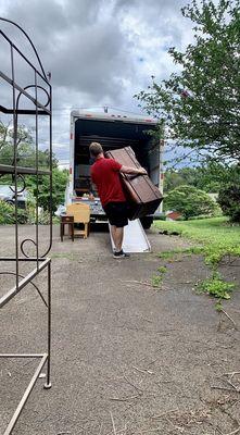 One guy carries a cedar chest!