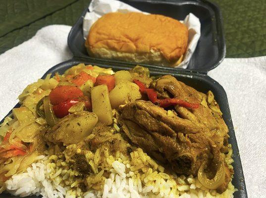 Curry chicken, cabbage, white rice and coco bread.