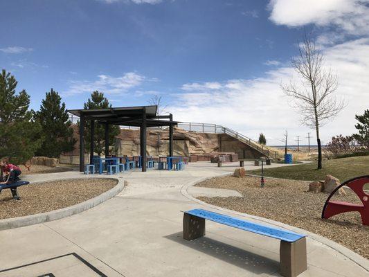 view to the right of playground at maze entrance. The far patio area is the splash pad fountain