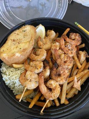 Shrimp skewers and salmon plate