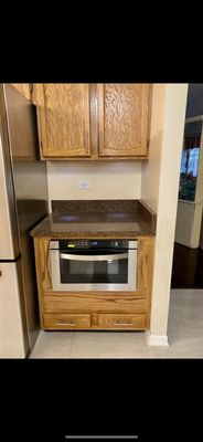 Custom reconstruction of old cabinet to install microwave  Drawers were originally at the top with cabinet doors