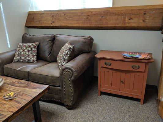 Client's sofa with complementary Yogi tea nearby